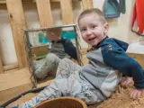 A toddler playing inside at Barton Moss Nursery