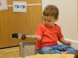 A toddler playing inside Belvedere nursery