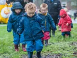 A group of children playing outside at Barton Moss Nursery