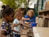 Children playing outside at Little Hulton Nursery