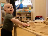 A toddler playing inside Winton nursery