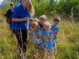 Some children playing outside at Higher Broughton Nursery